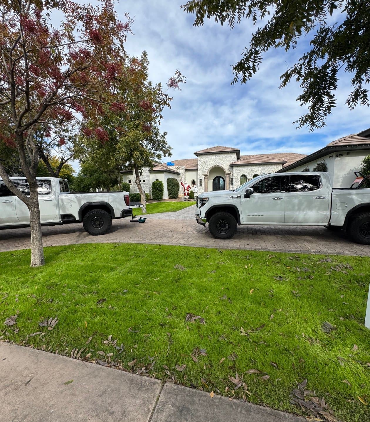 Vivid Roofs crew installing dark shingles on a residential roof